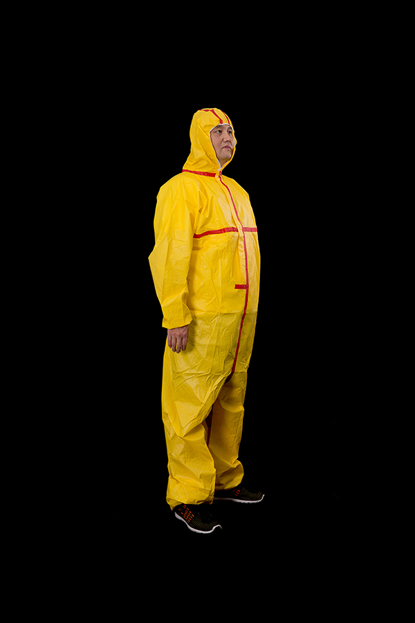 Yellow microporous coverall with red tape 